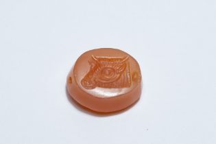 A Greco-Persian Red Agate Scarab Gem Depicting a Bull's Head.