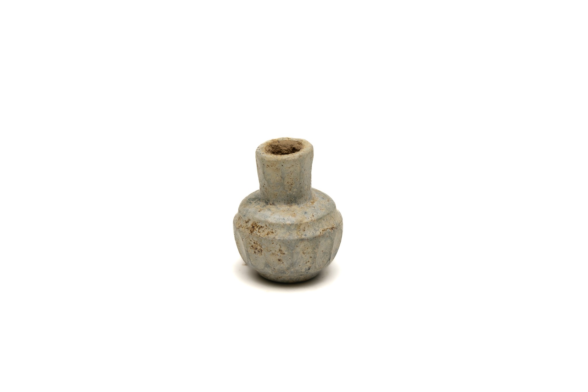 A Sassanian Light Green Cut Glass Small Bottle from the 7-8th Century.

H: Approximately 4.5cm 