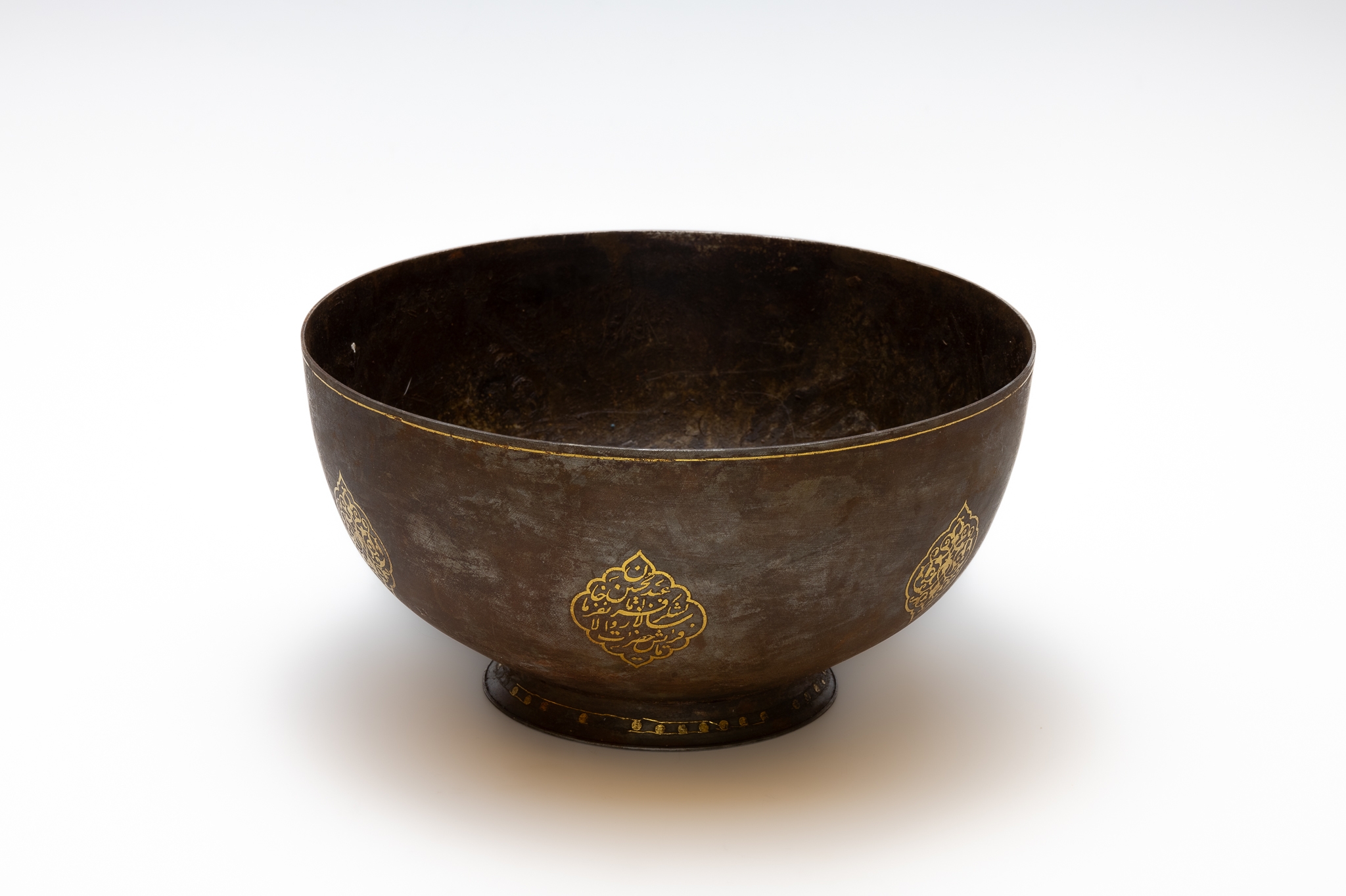 An Islamic Qajar Bowl with Islamic Calligraphy in Gold Inlay.

Approximately 23 x 12cm 