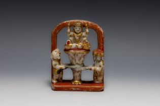 An Indian Alabaster Figure of a Deity and 2 Mystical People Beside.

H: Approximately 13.8cm 