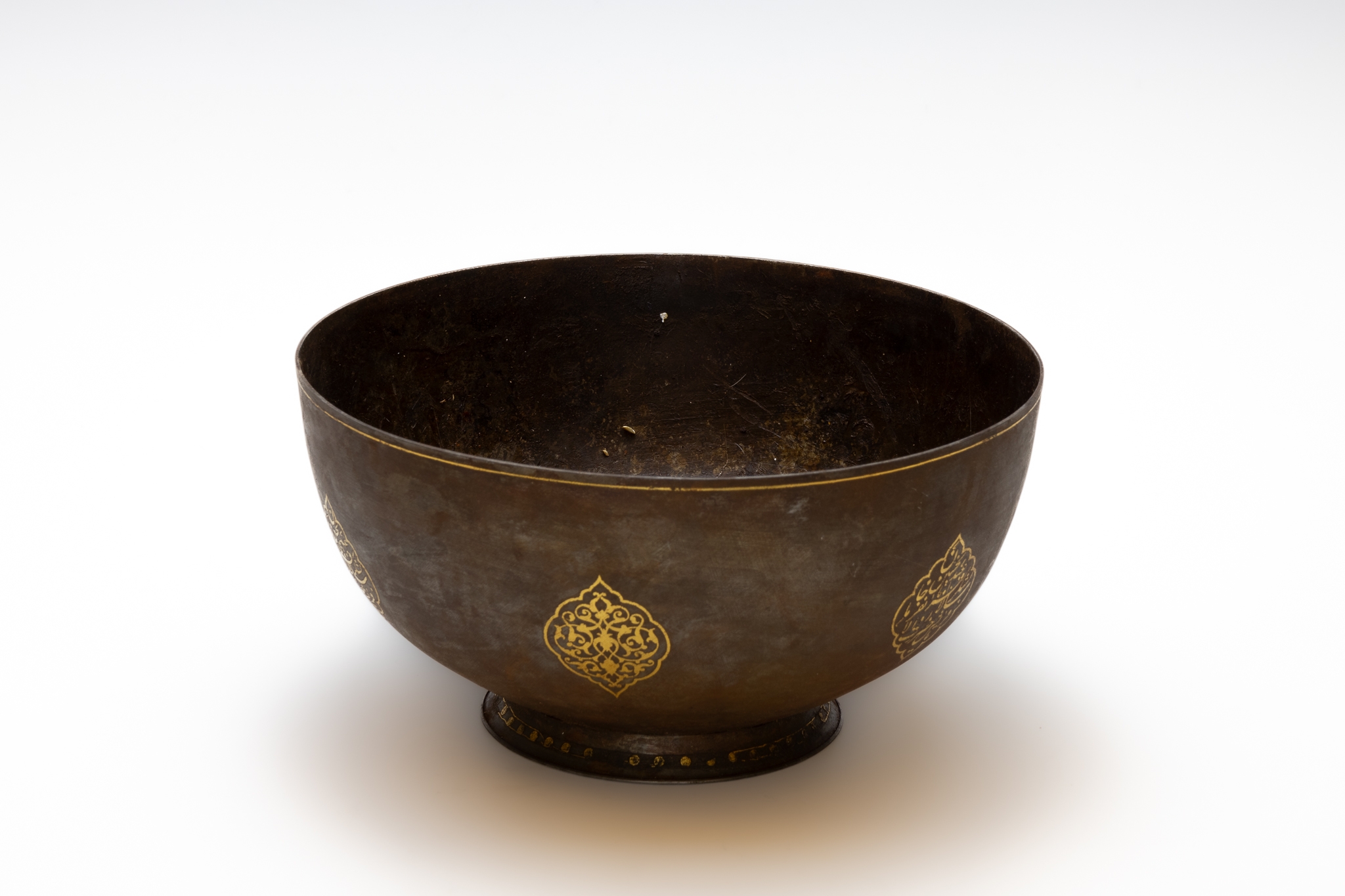 An Islamic Qajar Bowl with Islamic Calligraphy in Gold Inlay.

Approximately 23 x 12cm  - Image 2 of 2