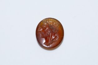 An Ancient Roman Red Agate Circular Stone Depicting Emperor Julius Caesar's Head. L: Approximately