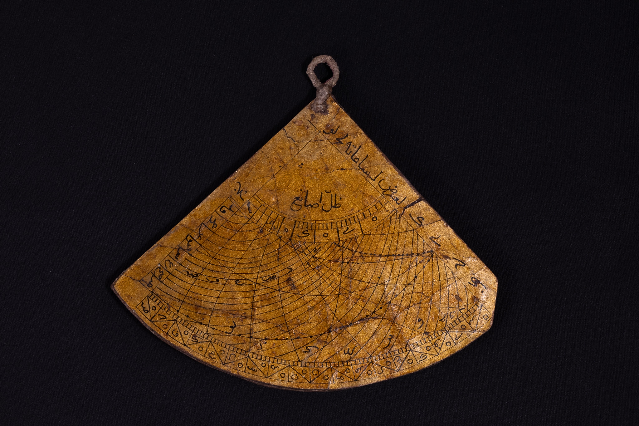 An Islamic Triangular Paper Mache Qibla Indicator and Sundial.

L: Approximately 13.5cm 
