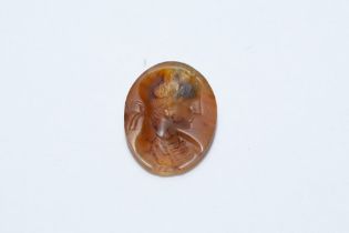 An Ancient Roman Red Circular Agate Stone Depicting a Roman Woman Deity. L: Approximately 1.9cm