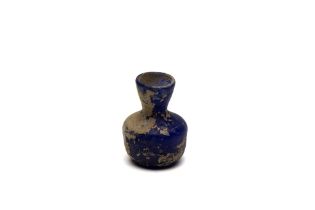 An Islamic Blue Glass with Nice Patina from the 11-12th Century.

H: Approximately 5.5cm 