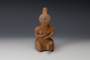 A Late Minoan or Turkish Terracotta Figure of a Seated Idol from 600 B.C. H: Approximately 18cm