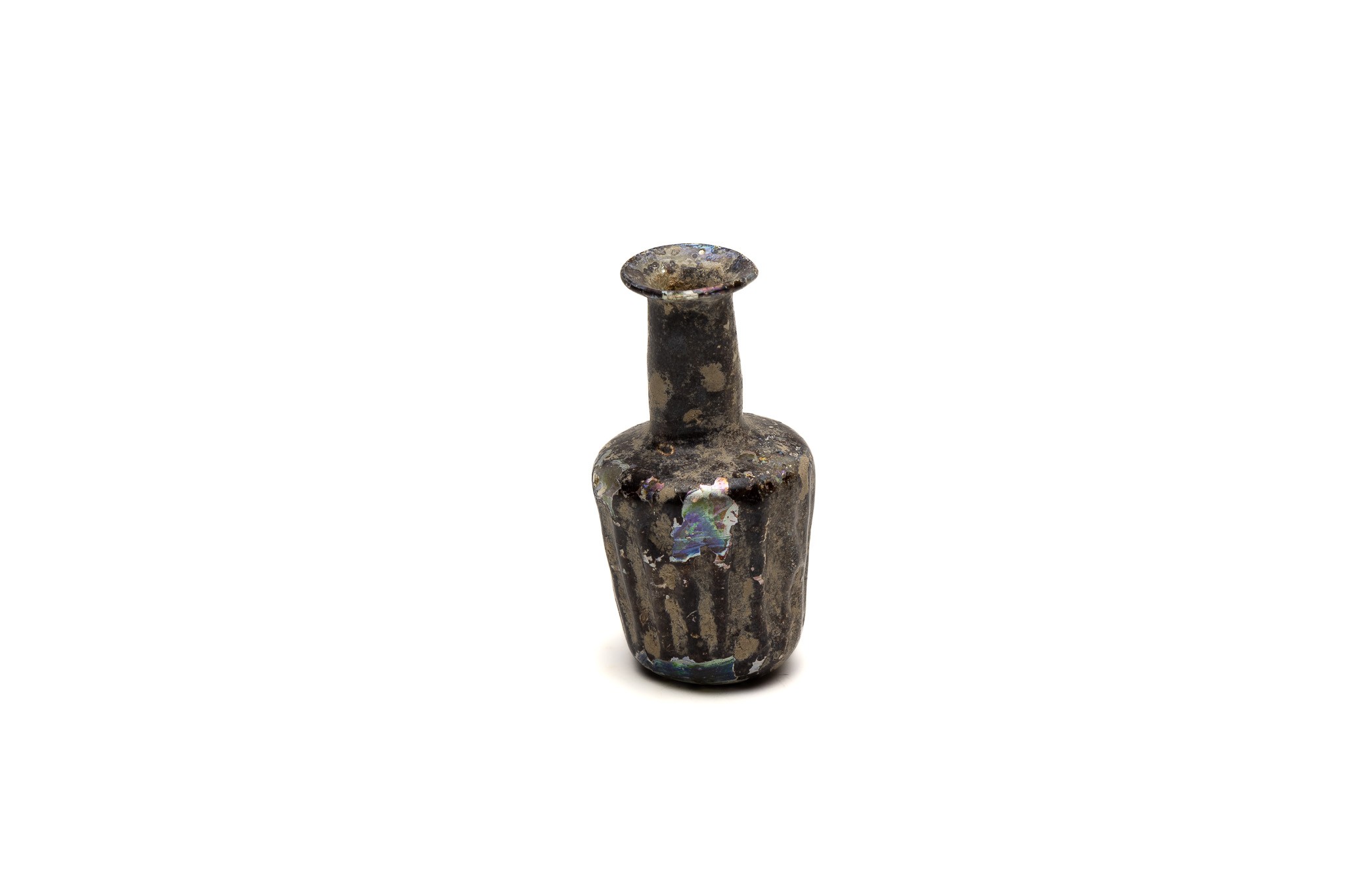An Islamic Light Green Glass Moulded Bottle with Lovely Patina from the 11-12th Century.

H: Approxi
