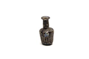 An Islamic Light Green Glass Moulded Bottle with Lovely Patina from the 11-12th Century. H: Approxi