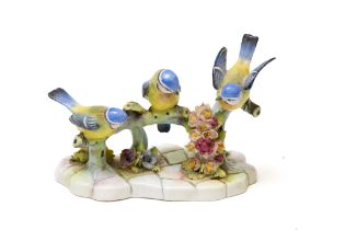 A Vintage English Porcelain Figure of 3 Birds on a Branch with Flowers.

Approximately 16x12cm 