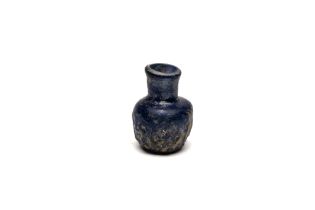 An Islamic Small Blue Moulded Glass with Patina from the 11-12th Century. H: Approximately 5cm