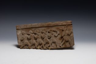 A Wooden Carved Panel Depicting Figures of Men Fighting.

L: Approximately 30cm
H: Approximately 14.