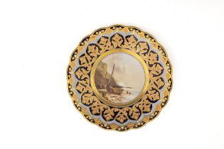 An Antique Continental Porcelain Plate Depicting a Ship on Shore.

D: Approximately 23cm 