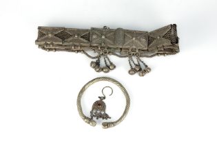 A Tribal Yemeni White Metal Belt with a White Metal Bracelet.

Belt L: Approximately 69cm

Belt: 474