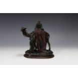 A Carl Kauba Bronze Figure of a Man on the Back of a Camel and Another Standing Below, Signed on Bas