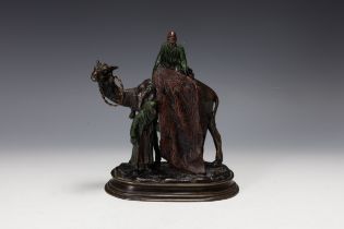 A Carl Kauba Bronze Figure of a Man on the Back of a Camel and Another Standing Below, Signed on Bas