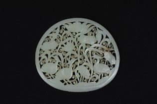 A Rare Large Chinese White Jade Circular Plaque Depicting Floral Patterns & Birds. Approximately 10