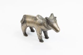 An Indian Mughal Bronze Figure of a Cow. L: Approximately 15.2cm