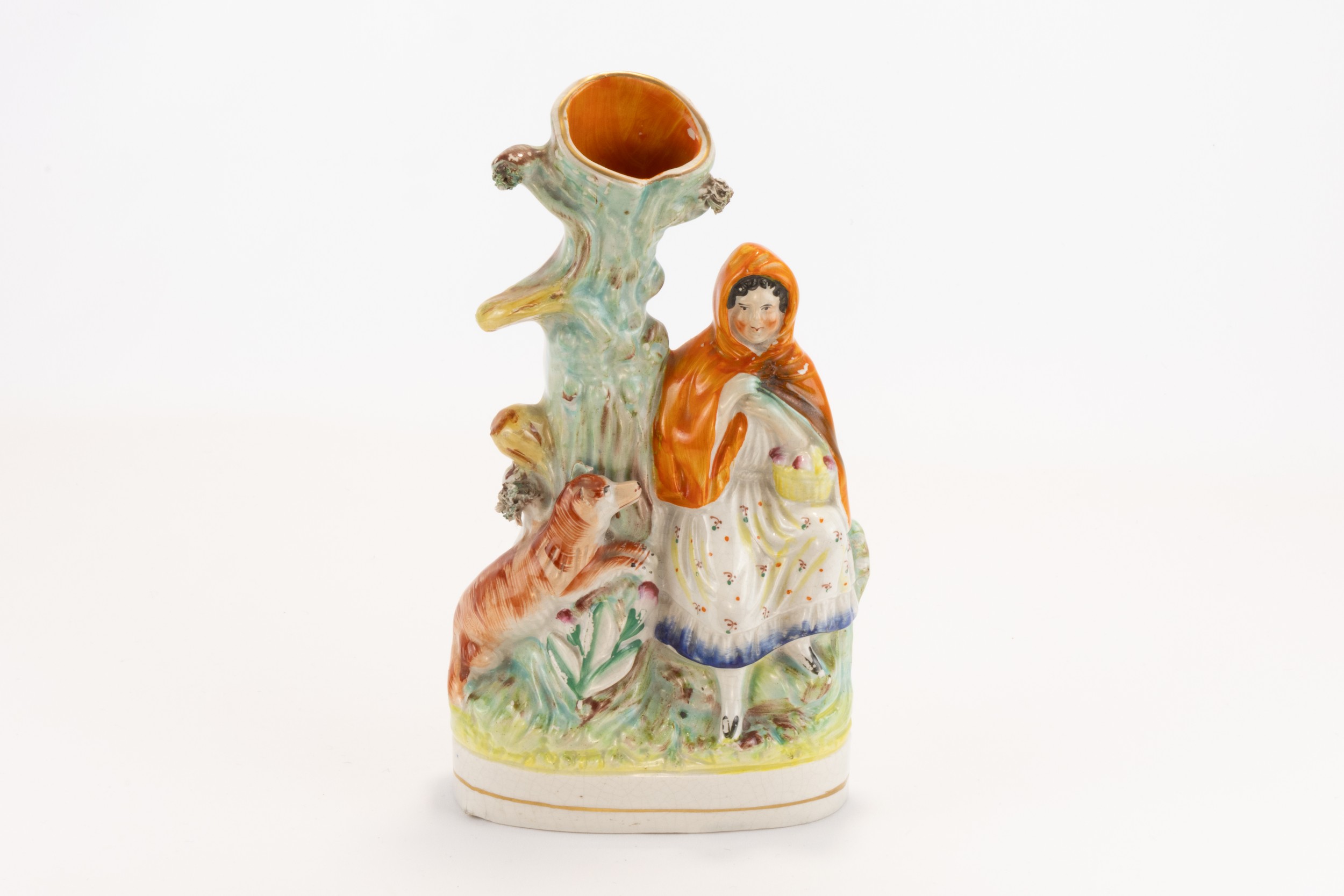 A Mid Victorian Staffordshire Spill Vase Depicting Little Red Riding Hood and the Wolf.

H: Approxim
