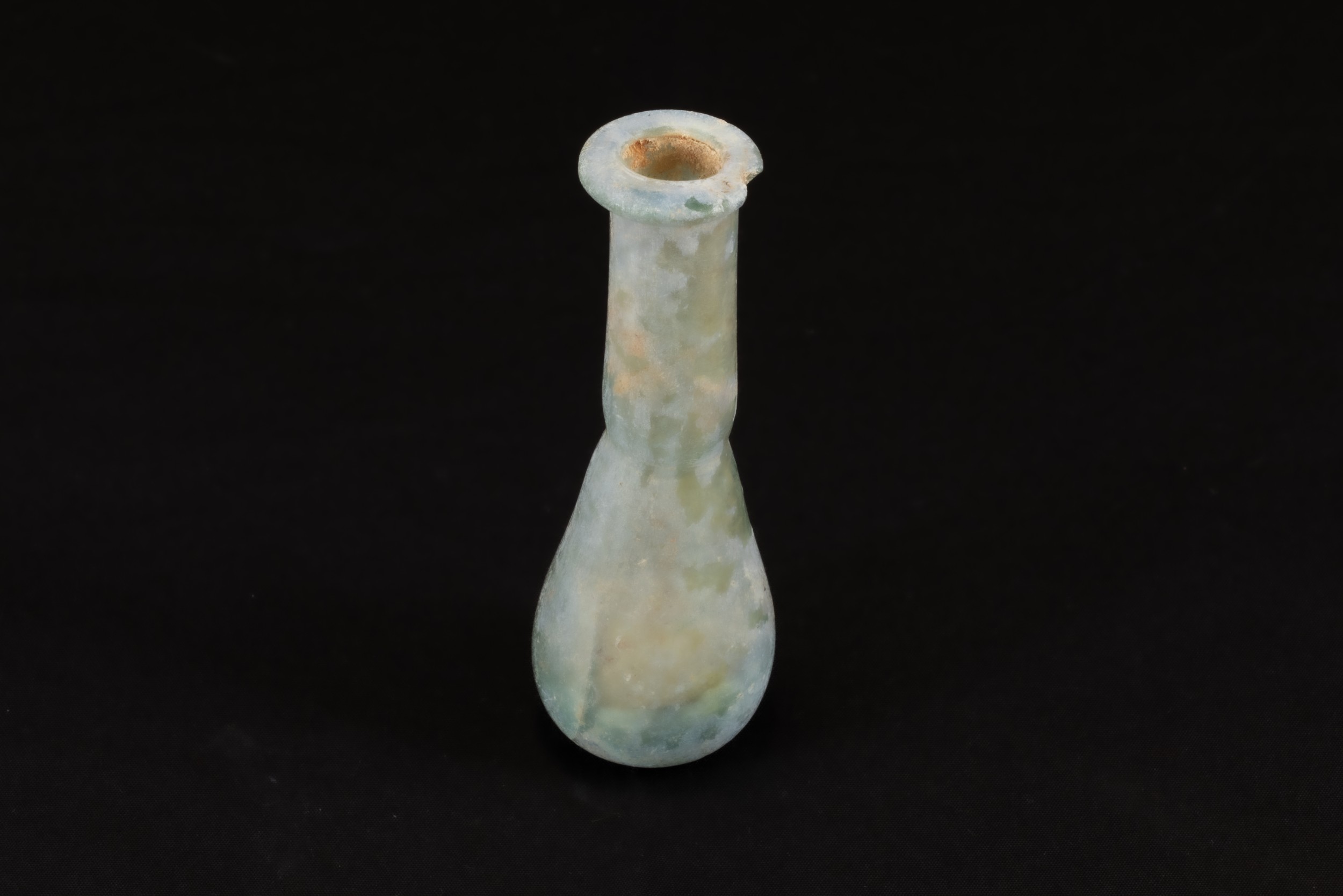 An Ancient Roman Glass Unguentarium Blown from Pale Translucent Glass with a Slight Teal Tint Circa 