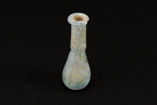 An Ancient Roman Glass Unguentarium Blown from Pale Translucent Glass with a Slight Teal Tint Circa