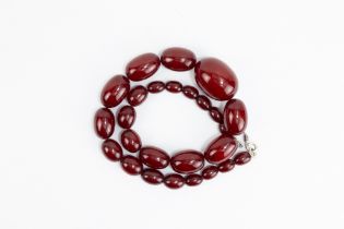 A Graduated Cherry Amber Beads Necklace. 78g