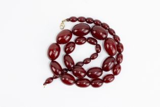 A Graduated Cherry Amber Beads Necklace. 68g