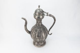 An Indian White Metal Ewer Decorated with Intricate Carvings of Floral Patterns. H: Approximately