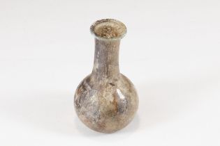 An Ancient Roman Glass Unguentarium Blown from Translucent Glass that now Displays a Slight Aubergin