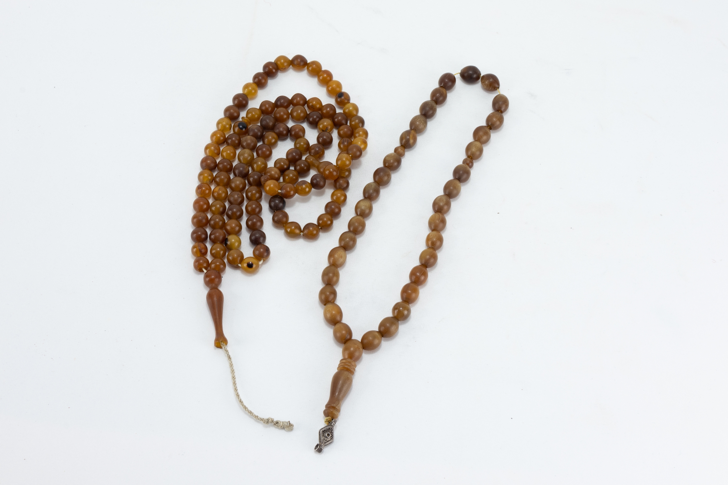 A Lot of 2 Islamic Ottoman Horn Prayer Beads Possibly Rhino.

Short Prayer Bead: 25.7g
Longer Prayer