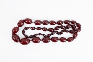 A Graduated Cherry Amber Beads Necklace. 100g