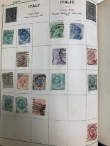 World stamp range in old The Triumph album published by G.F. Rapkin