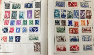 Useful world stamp collection in The Triumph Stamp Album, including Great Britain with 1934 Re-