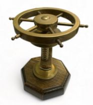 Brass Ships Wheel in the form of a nutcracker mounted on a wooden stand. Working order.