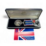 A boxed National Service medal to 5384452 SPR E. POWELL RE.