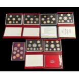 Collection of proof cased sets (7) with 1970, 1986, deluxe proof cased sets FDC 1994, 1995, 1996,