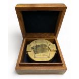 Brass Ships Compass housed in an attractive wooden box with anchor Cartouche.
