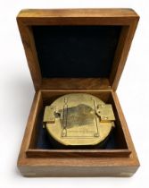 Brass Ships Compass housed in an attractive wooden box with anchor Cartouche.