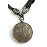 A 26mm hallmarked silver (Mappin & Webb,1914) Emma Cunliffe-Owen tribute medallion for men of the '