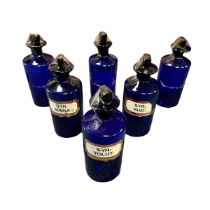 6 Cobalt Blue Apothecary Jars 24cm x 9cm, all 6 jars have chisel stoppers, one stopper has a chip on