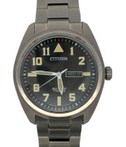 Citizen Eco Drive Titanium - E101-S125774 wristwatch. Black dial with Arabic numeral hands/ baron