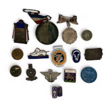 A small collection of badges, medals, buttons etc. Includes: Austin Motor Company winged steering