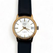 A 1960s Shield 17 jewel manual date watch with gold plated case, silver dial and baton hour