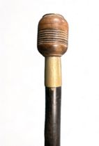 Ebonised walking Stick with unusual treen pommel that unscrews to reveal a space to store a coin.