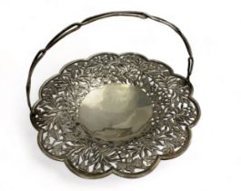 A Chinese silver basket with floral pierced decoration. Diameter 22.2cm. 321g.