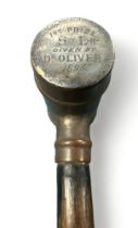 Ebonised walking Stick with unusual brass barrel handle. Inscription on one end of barrel: "1st