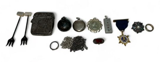 Collection of silver items to include vesta case, sovereign holder, pair of pickle forks. ingot,