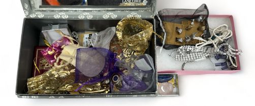A box of costume and silver jewellery. Includes a rolled gold bangle, a silver necklace with
