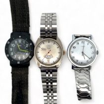 Three Watches. A 1978 manual Timex chrome plated watch with white dial, Arabic numeral markers and