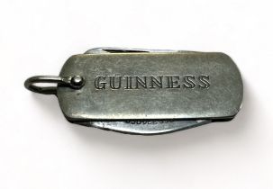 Guinness, vintage Guinness pen knife / bottle opener with fold out twin tool action and hoop to be