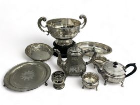 A range of silver plate/ white metal items: punch bowl on wooden stand, ornate coffee pot, teapot